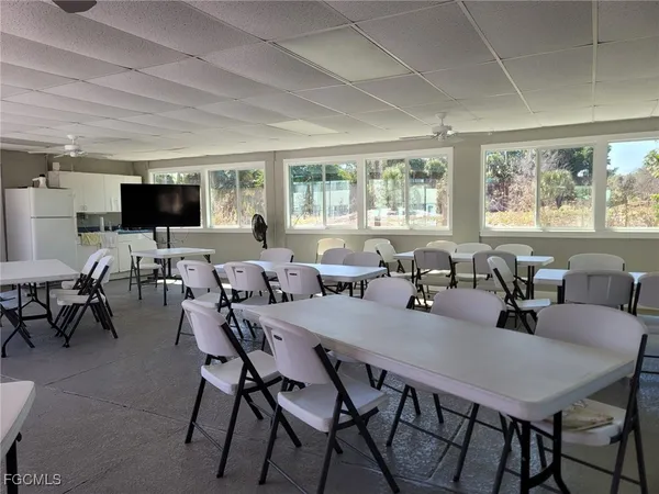 a view of a dining room with furniture and window