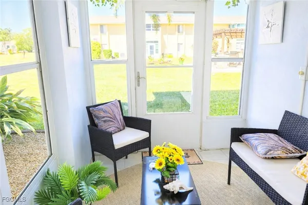 a living room with furniture and a window