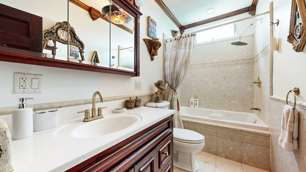 52 Thornton Park Winthrop, MA 02152 - Photo 17 of 40 a bathroom with a sink a toilet and a bathtub