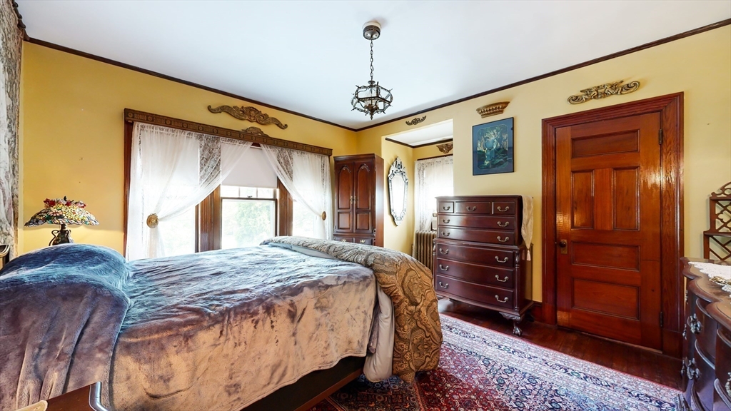 52 Thornton Park Winthrop, MA 02152 - Photo 19 of 40 a bedroom with a bed dresser and a window