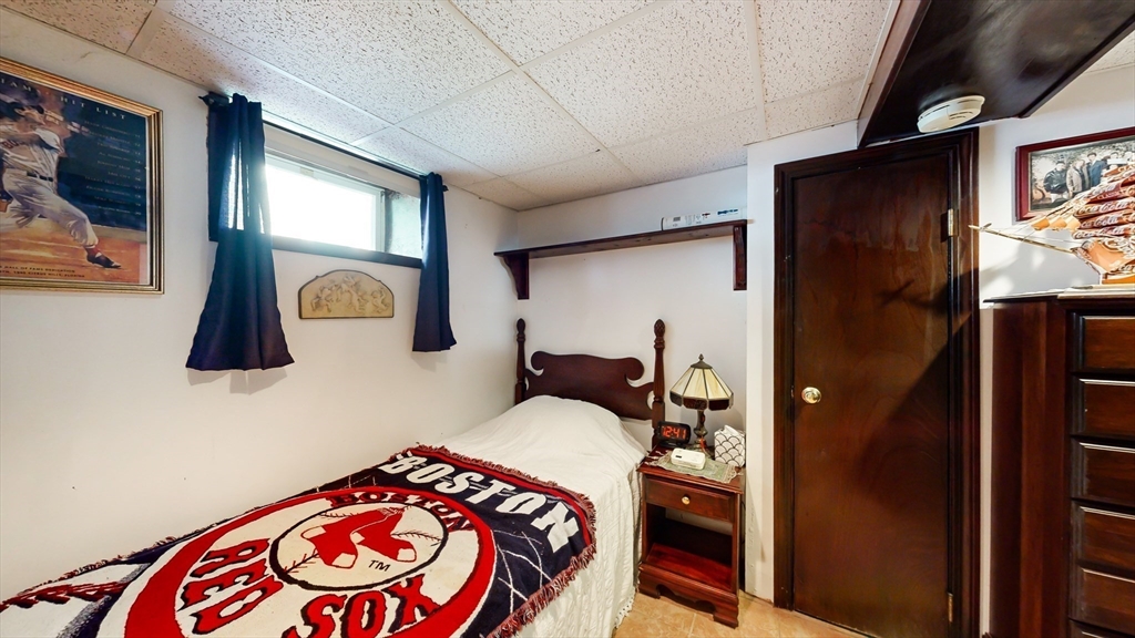 52 Thornton Park Winthrop, MA 02152 - Photo 27 of 40 a bedroom with a bed and a lamp on dresser
