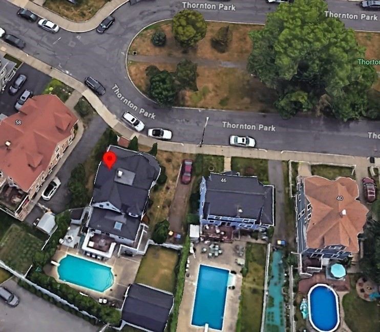 52 Thornton Park Winthrop, MA 02152 - Photo 3 of 40 an aerial view of a fireplace with table and chairs