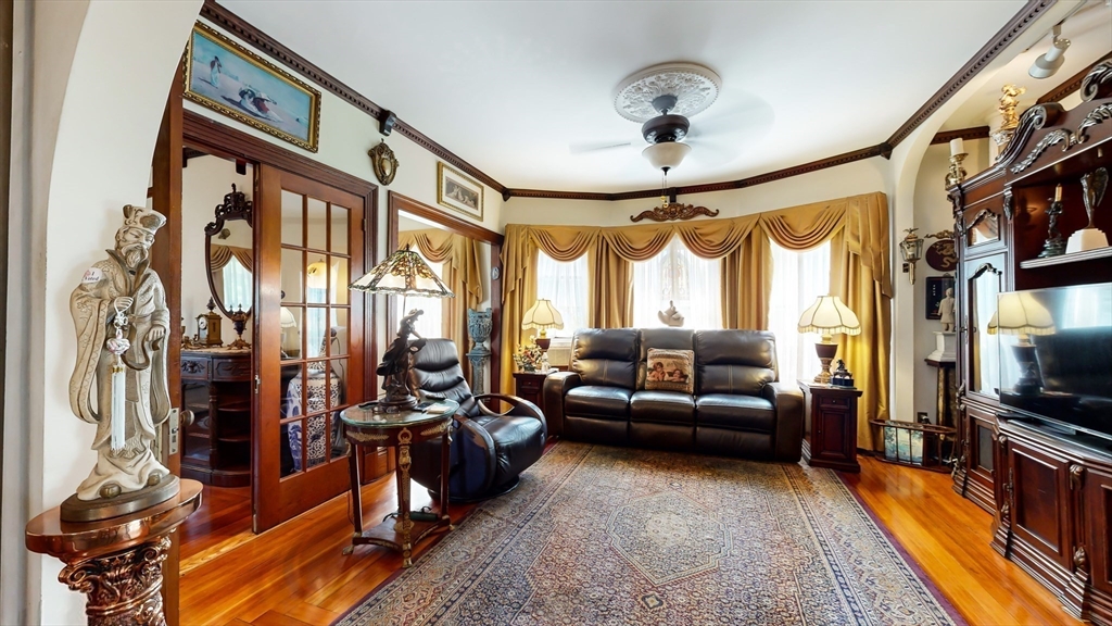 52 Thornton Park Winthrop, MA 02152 - Photo 9 of 40 a living room with furniture flat screen tv and a large window