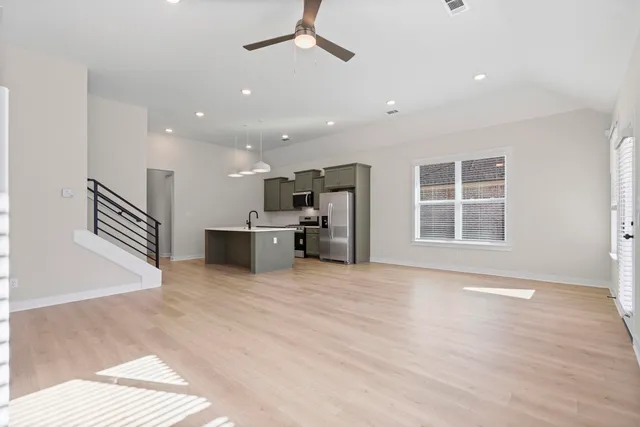 a view of a kitchen with a sink and a window