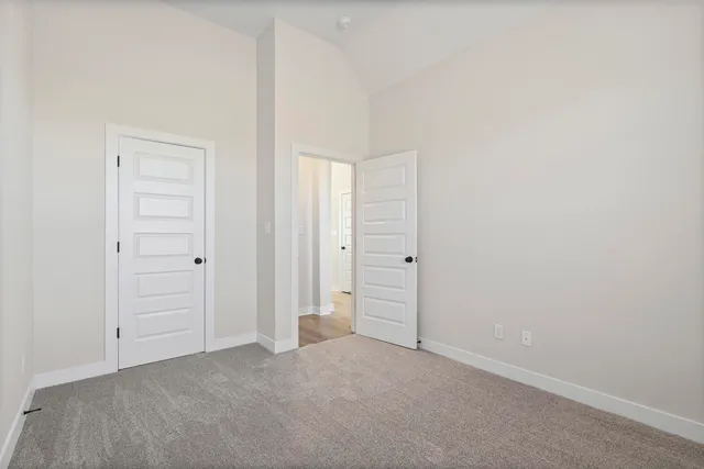 an empty room with closet area