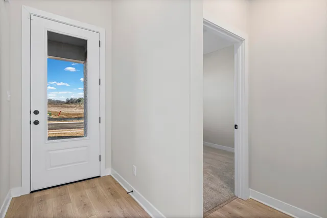 a view of front door with a bathroom