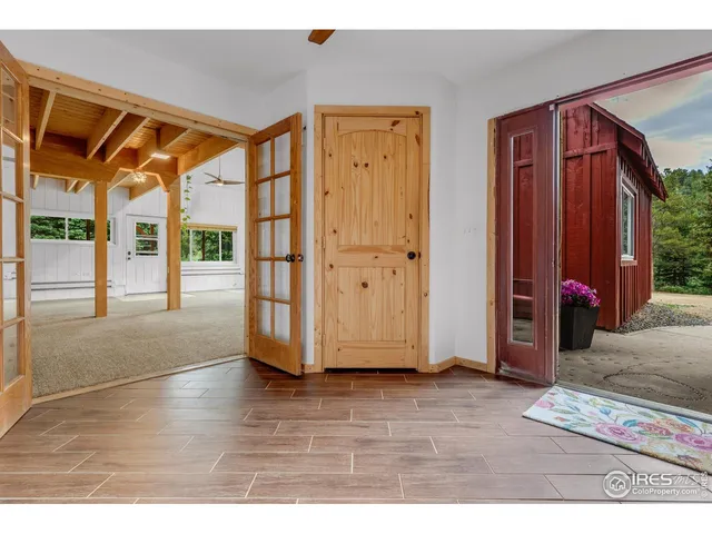 a view of front door with wooden floor