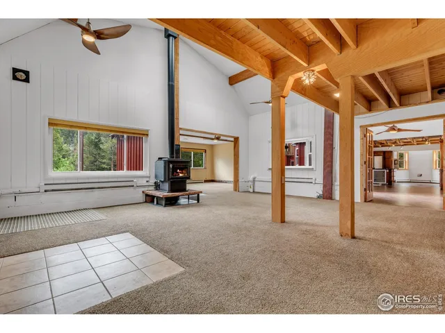 a view of living room with furniture and window