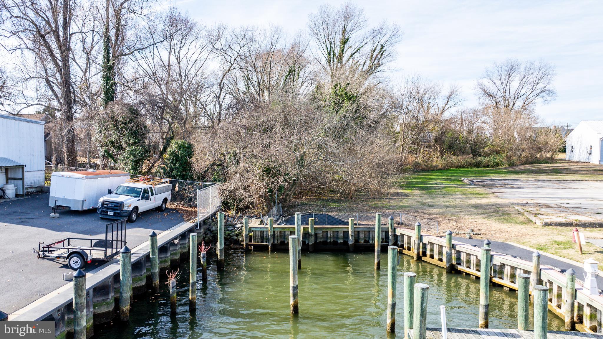 300 Muir Street Cambridge, MD 21613 - Photo 6 of 7 a view of house with yard and outdoor seating