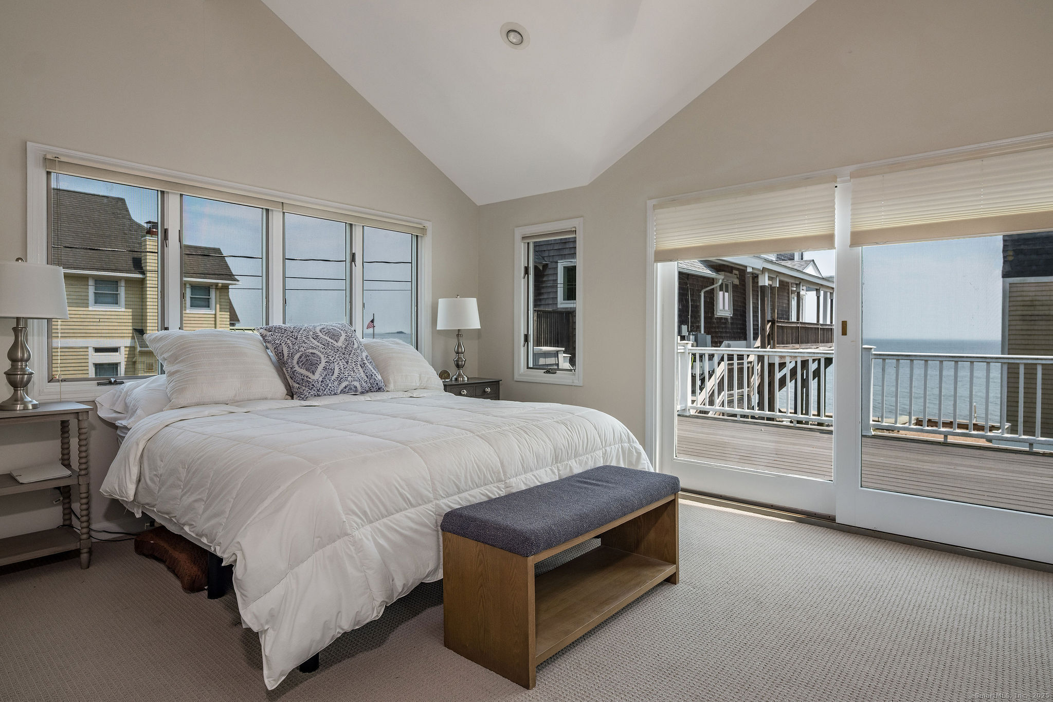 153 Shore Road, Unit 2 Clinton, CT 06413 - Photo 12 of 14 a bed room with a bed and a large window