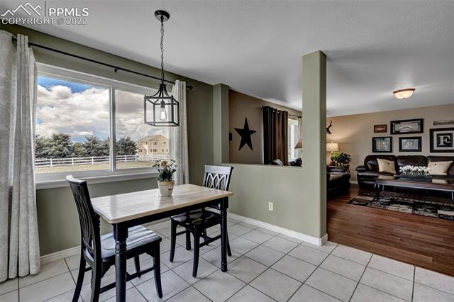 8460 Tibbs Road Peyton, CO 80831 - Photo 14 of 37 Kitchen & Eat In Area Open to Family Room