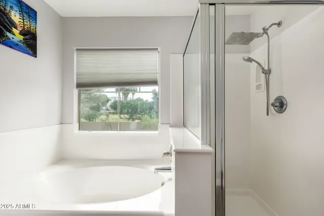 a white bath tub sitting next to a window