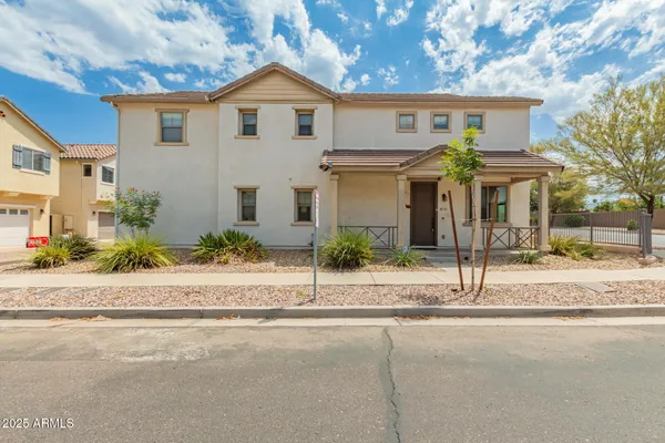 front view of a house with a small yard