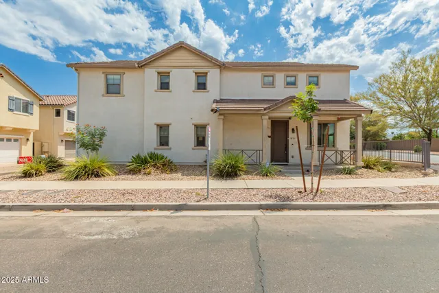 front view of a house with a small yard