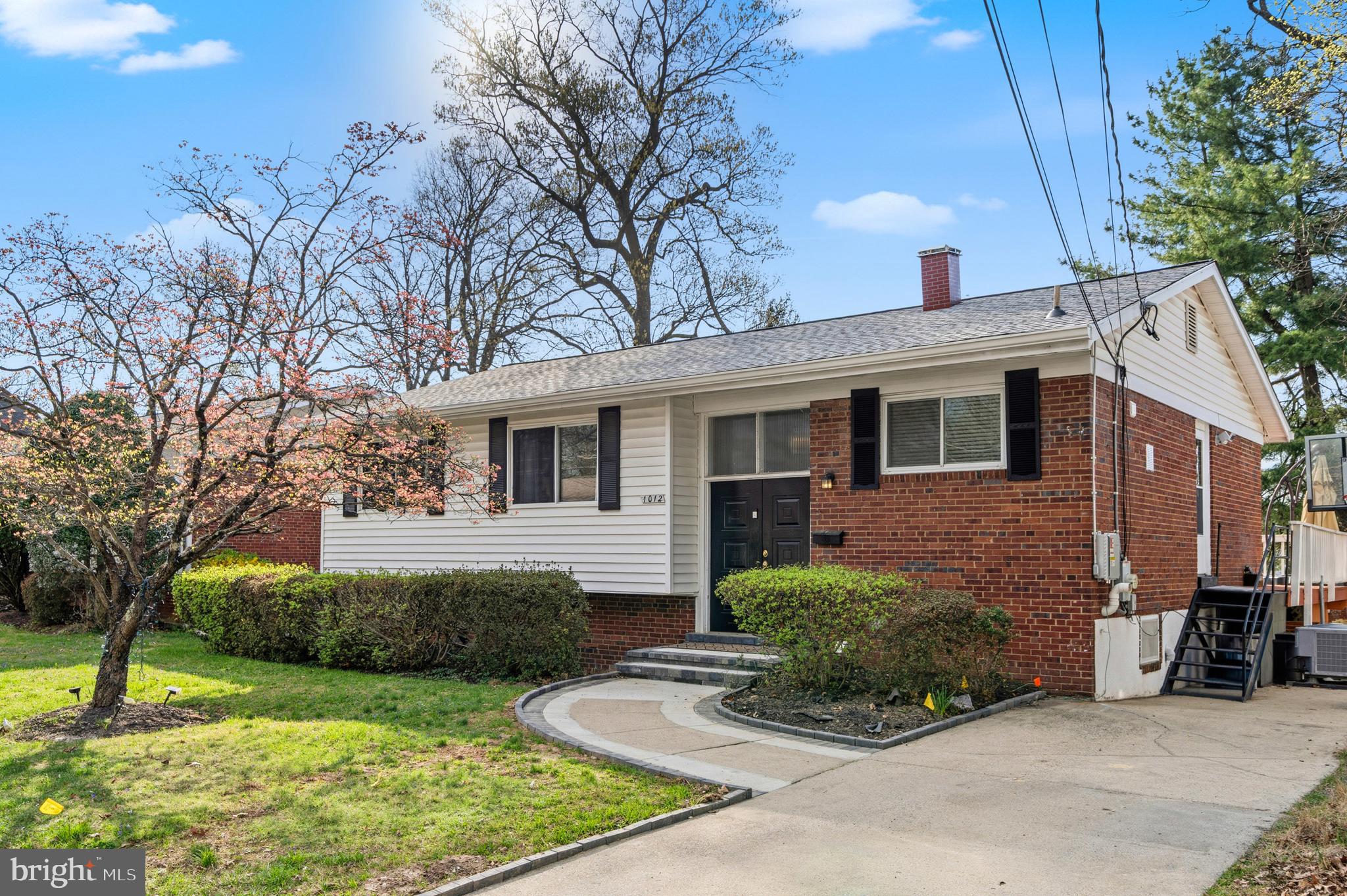 1012 Loxford Terrace Silver Spring, MD 20901 - Photo 1 of 52 a front view of a house with garden