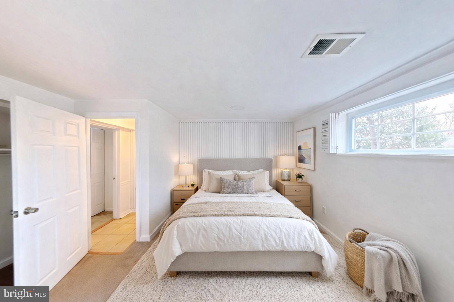 1012 Loxford Terrace Silver Spring, MD 20901 - Photo 17 of 52 a bedroom with a bed and a window