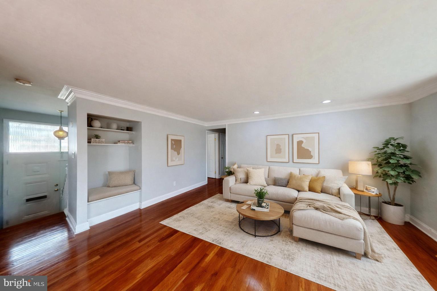 1012 Loxford Terrace Silver Spring, MD 20901 - Photo 2 of 52 a living room with furniture and a wooden floor