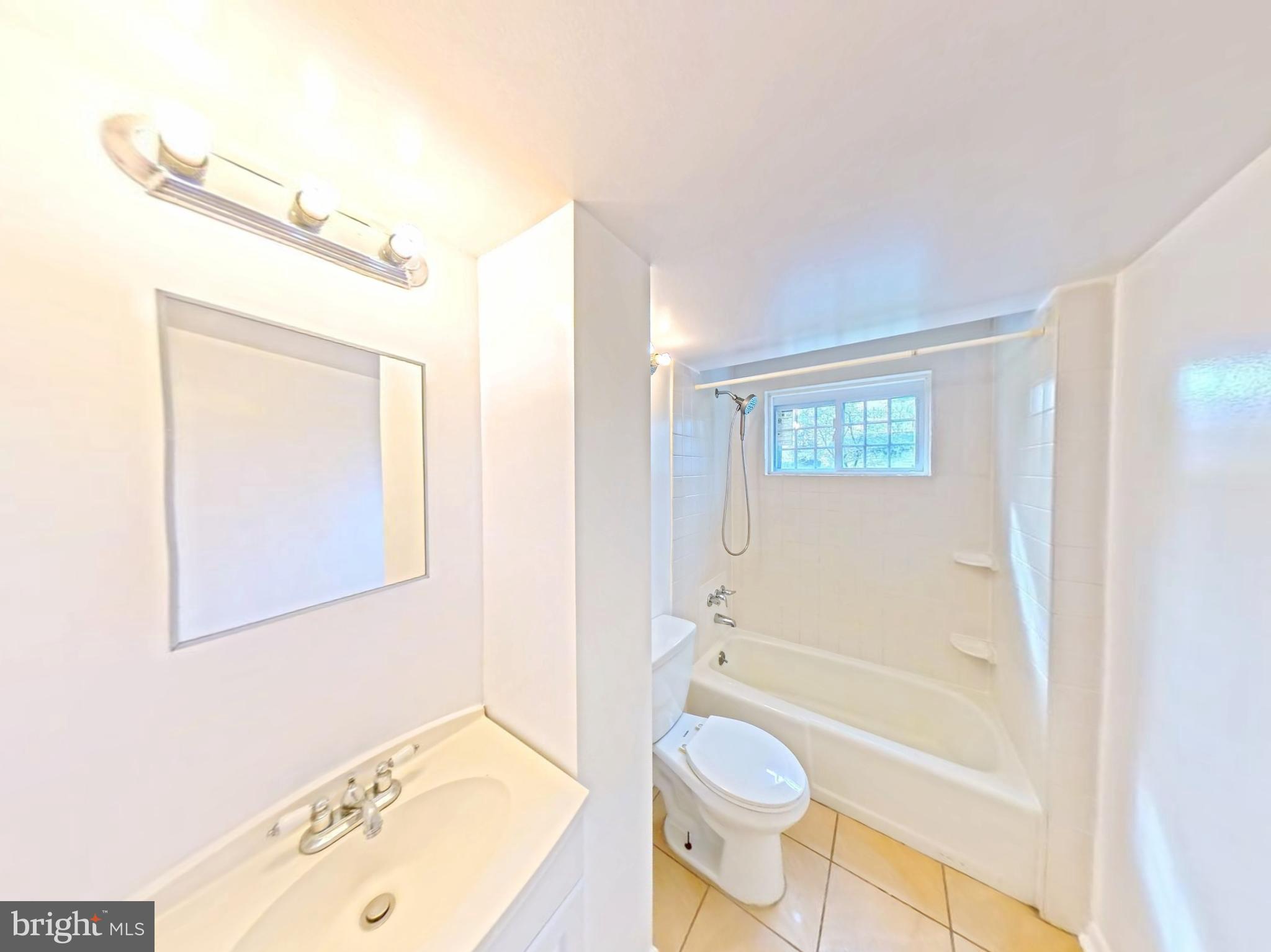 1012 Loxford Terrace Silver Spring, MD 20901 - Photo 21 of 52 a bathroom with a sink a toilet and shower