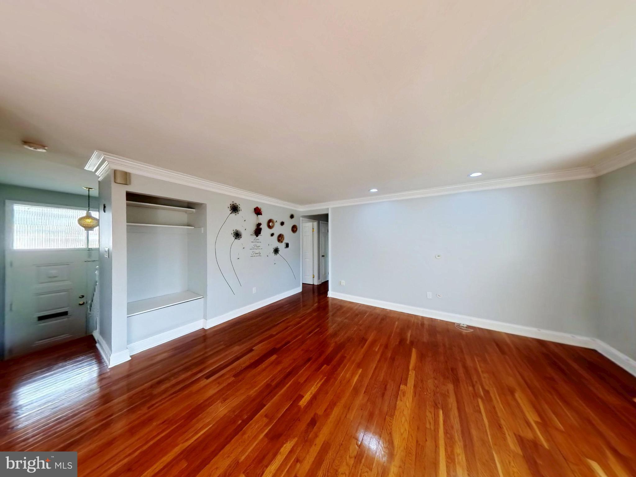 1012 Loxford Terrace Silver Spring, MD 20901 - Photo 27 of 52 a view of empty room with wooden floor