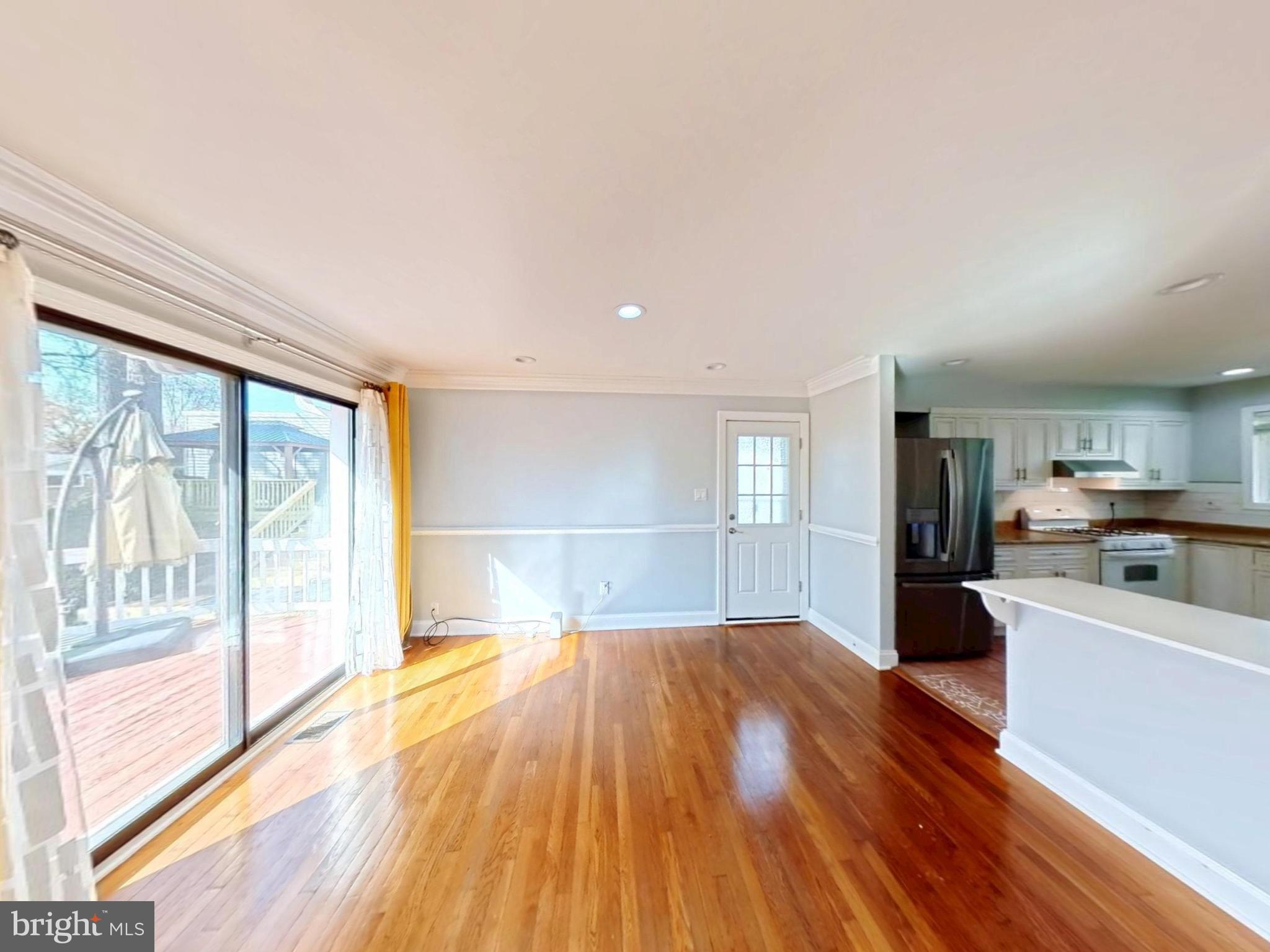 1012 Loxford Terrace Silver Spring, MD 20901 - Photo 38 of 52 a view of a kitchen with wooden floor and electronic appliances