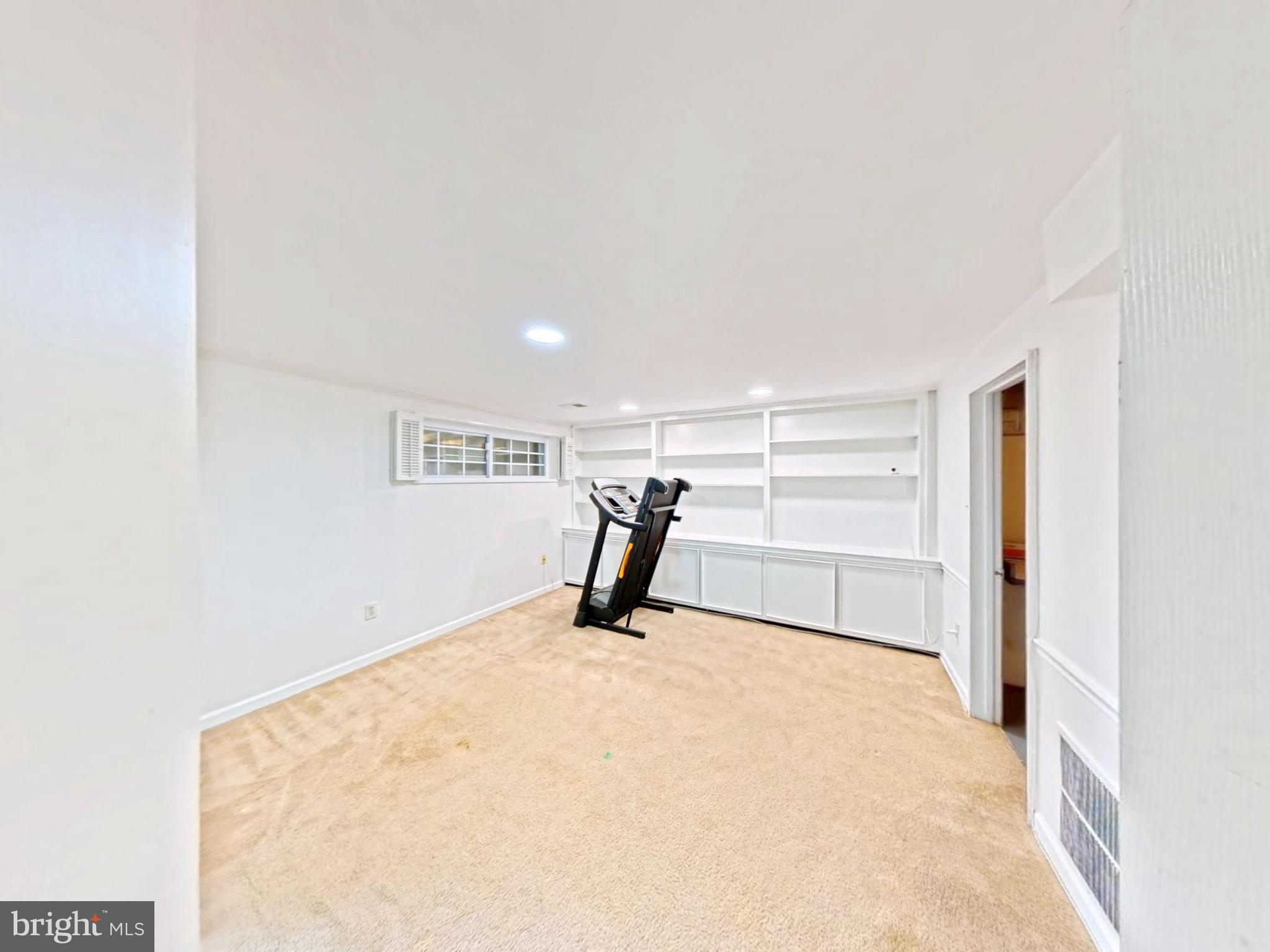 1012 Loxford Terrace Silver Spring, MD 20901 - Photo 43 of 52 a view of a room with a projector and a window