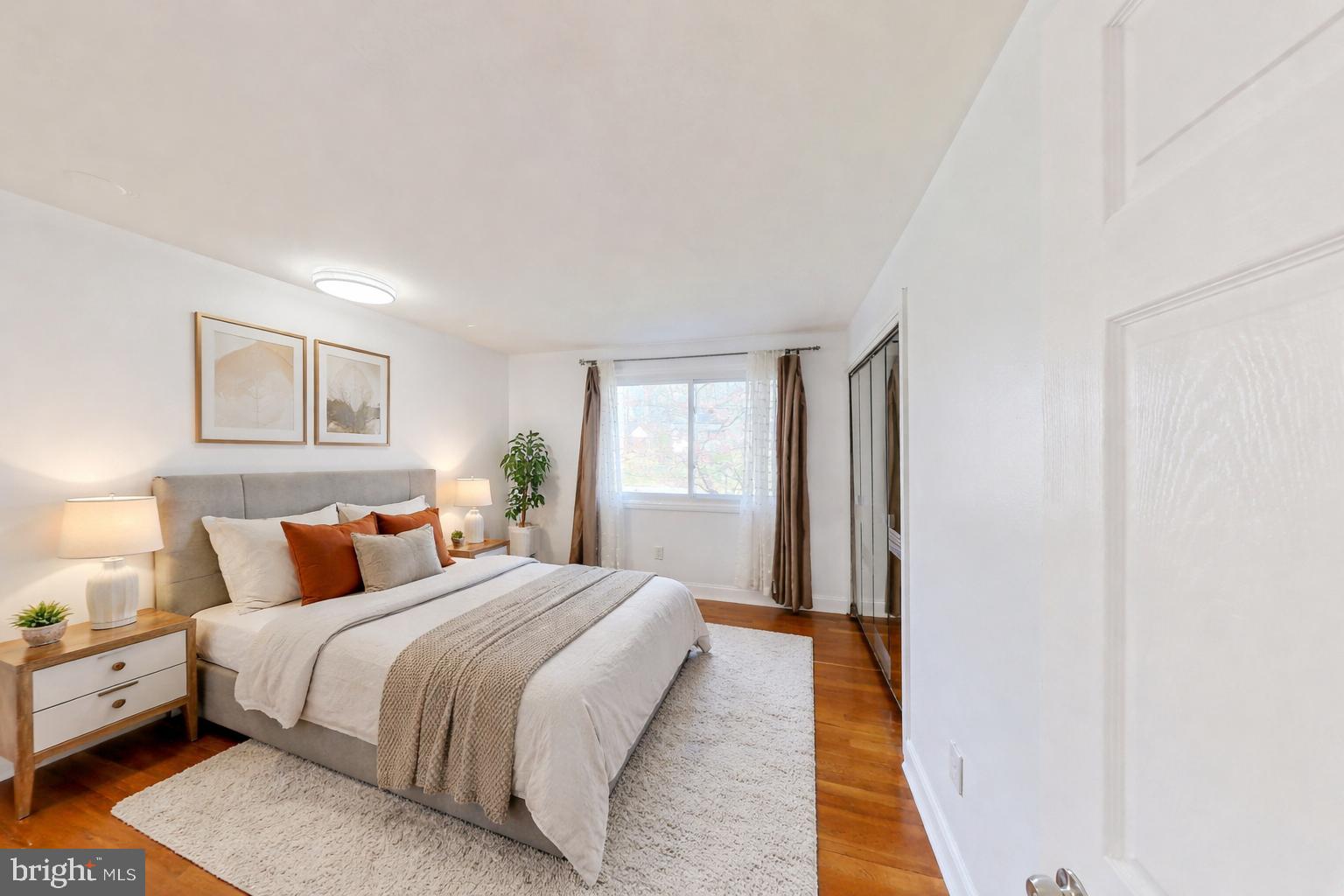 1012 Loxford Terrace Silver Spring, MD 20901 - Photo 8 of 52 a bedroom with a bed and a window