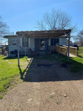 a view of a house with swimming pool and yard