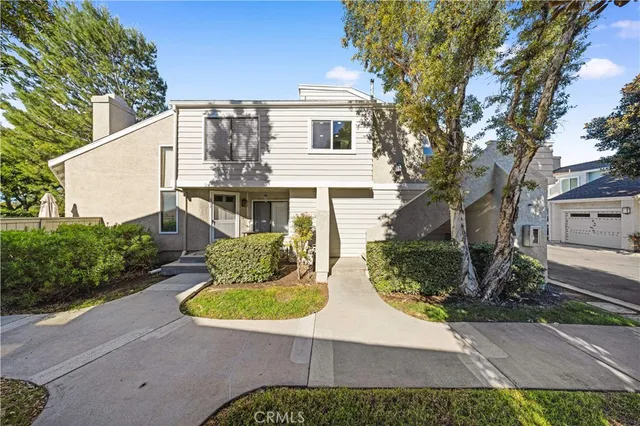 a view of a patio with couches chairs and potted plants