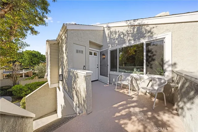 a kitchen with granite countertop a sink a stove and cabinets
