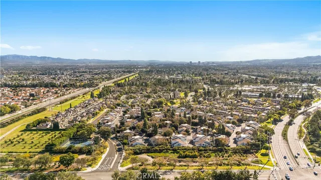 an aerial view of a residential houses with outdoor space