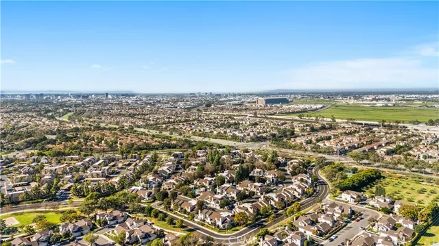 an aerial view of a house with a yard