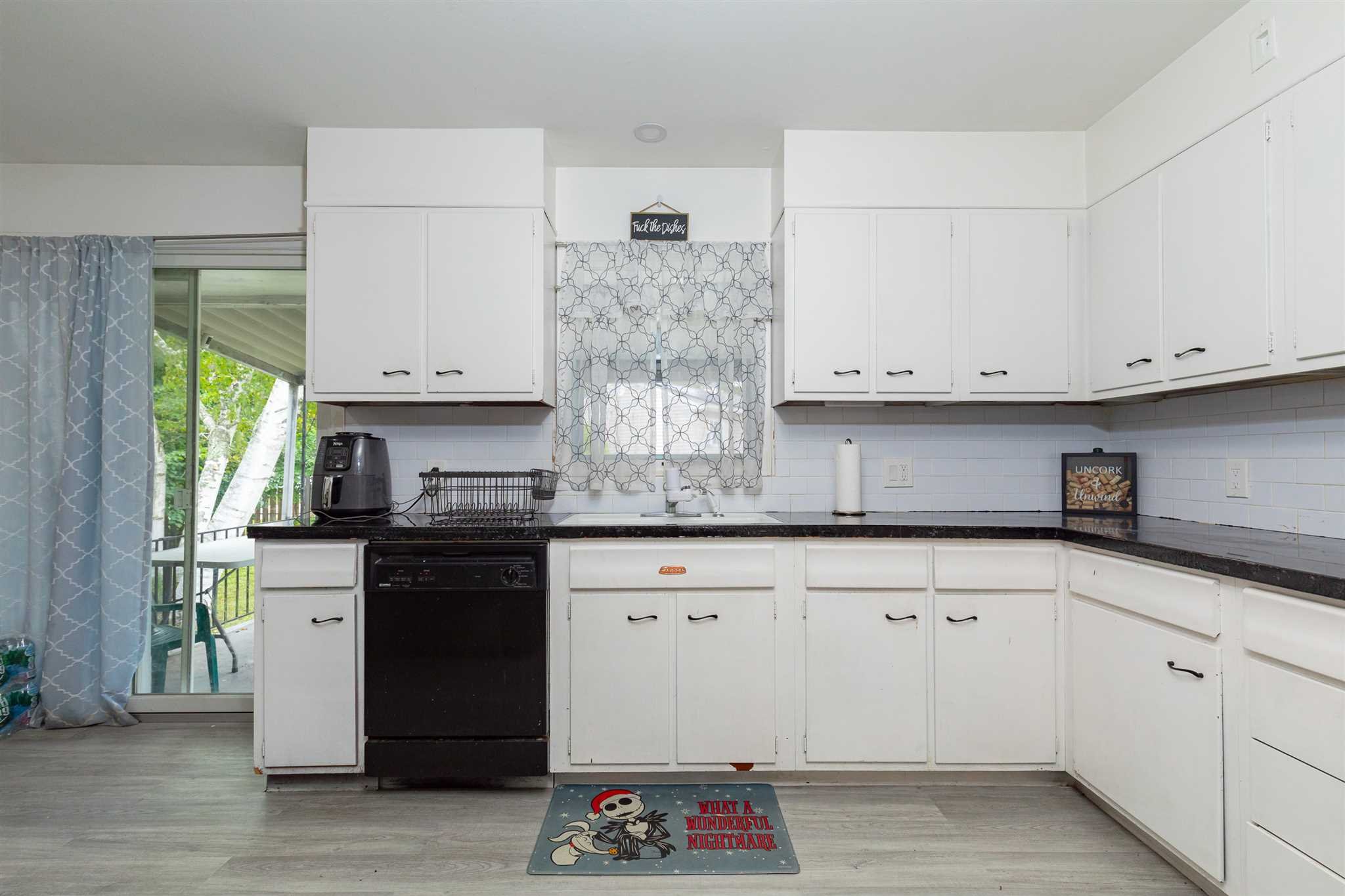 115 Spackenkill Road Poughkeepsie, NY 12603 - Photo 12 of 22 a kitchen with granite countertop white cabinets and a stove