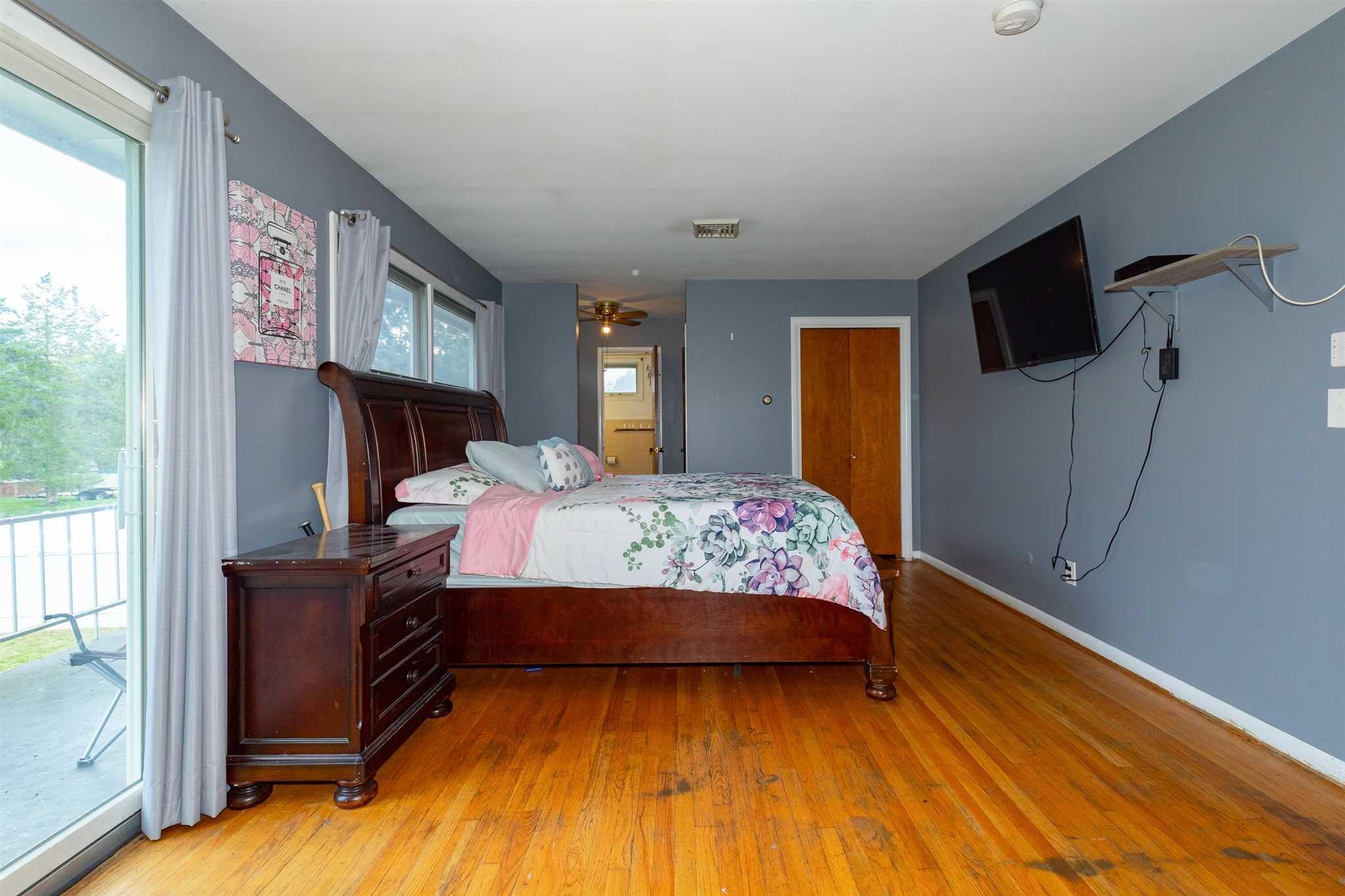 115 Spackenkill Road Poughkeepsie, NY 12603 - Photo 14 of 22 a bedroom with a bed window and flat screen tv