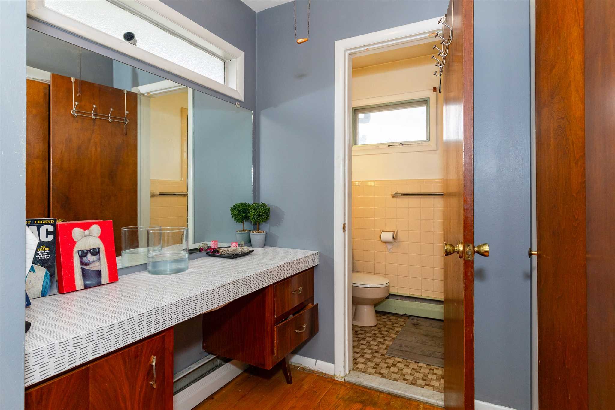 115 Spackenkill Road Poughkeepsie, NY 12603 - Photo 15 of 22 a bathroom with a granite countertop sink and a mirror