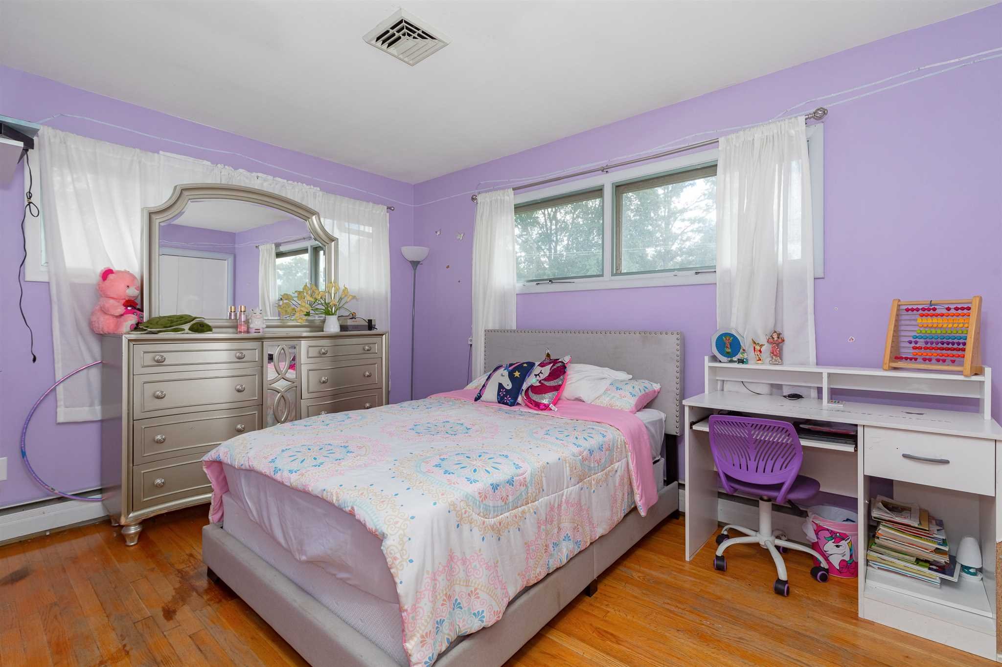 115 Spackenkill Road Poughkeepsie, NY 12603 - Photo 17 of 22 a bedroom with a bed and a dresser