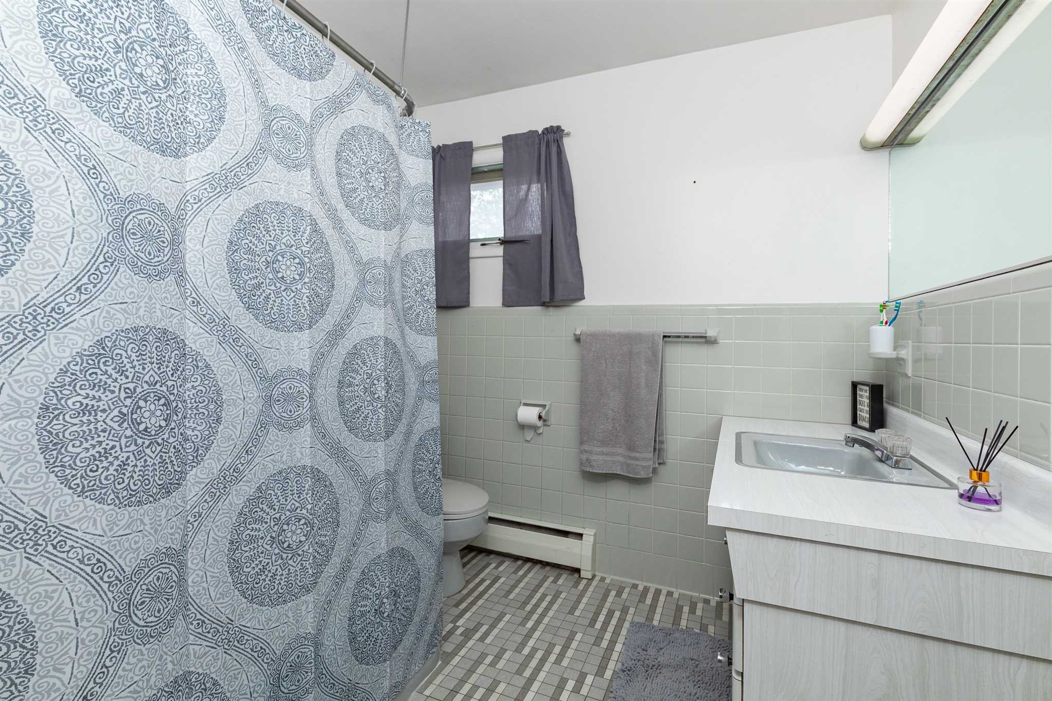 115 Spackenkill Road Poughkeepsie, NY 12603 - Photo 19 of 22 a bathroom with a sink and mirror