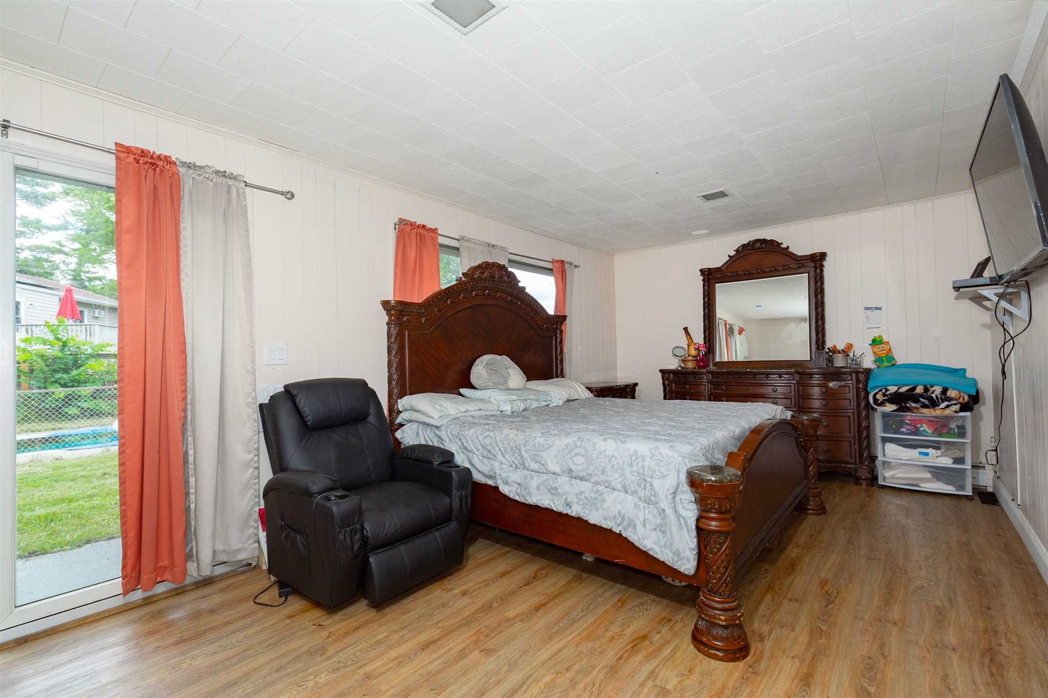 115 Spackenkill Road Poughkeepsie, NY 12603 - Photo 21 of 22 a bedroom with a bed and wooden floor