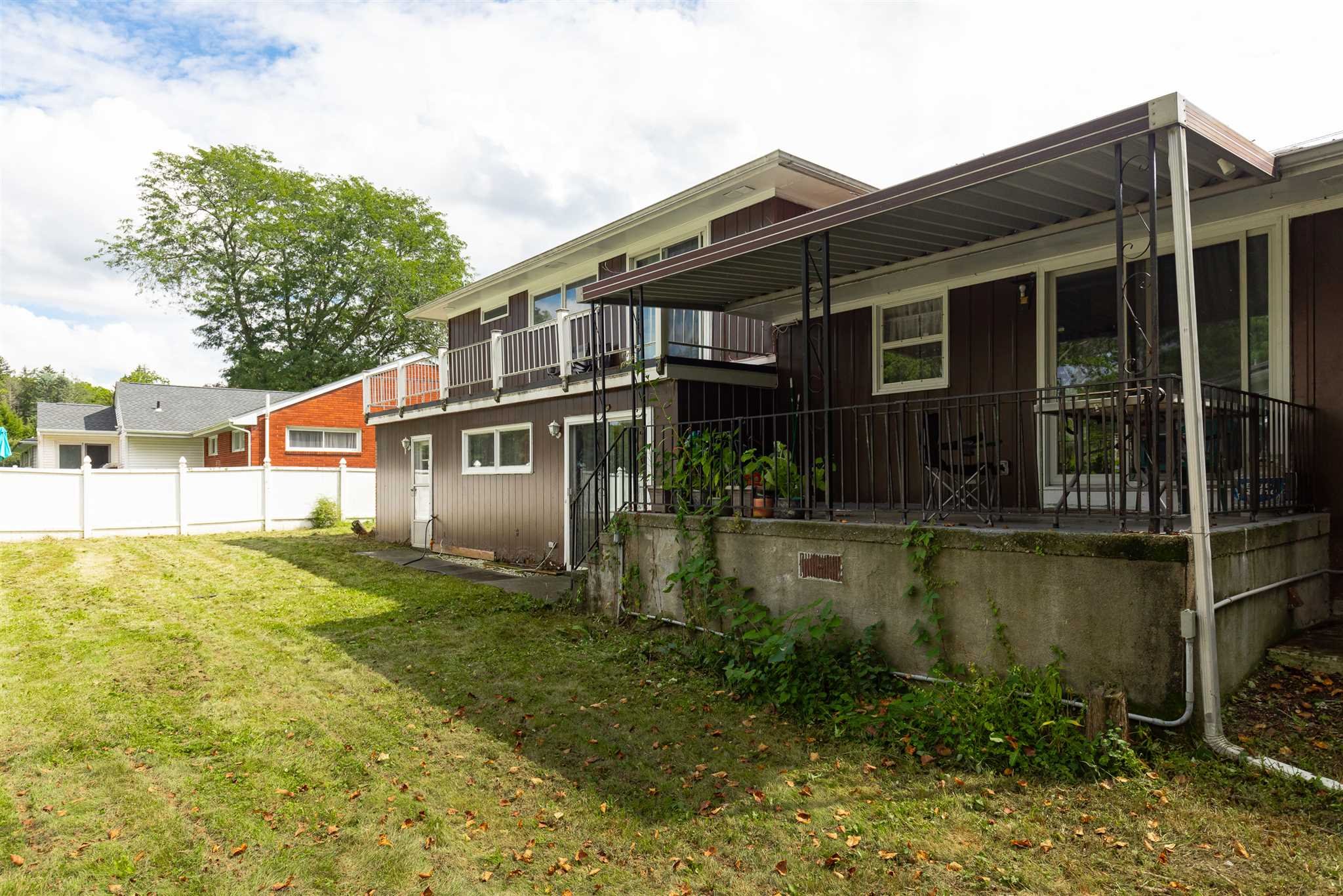 115 Spackenkill Road Poughkeepsie, NY 12603 - Photo 5 of 22 a front view of a house with swimming pool