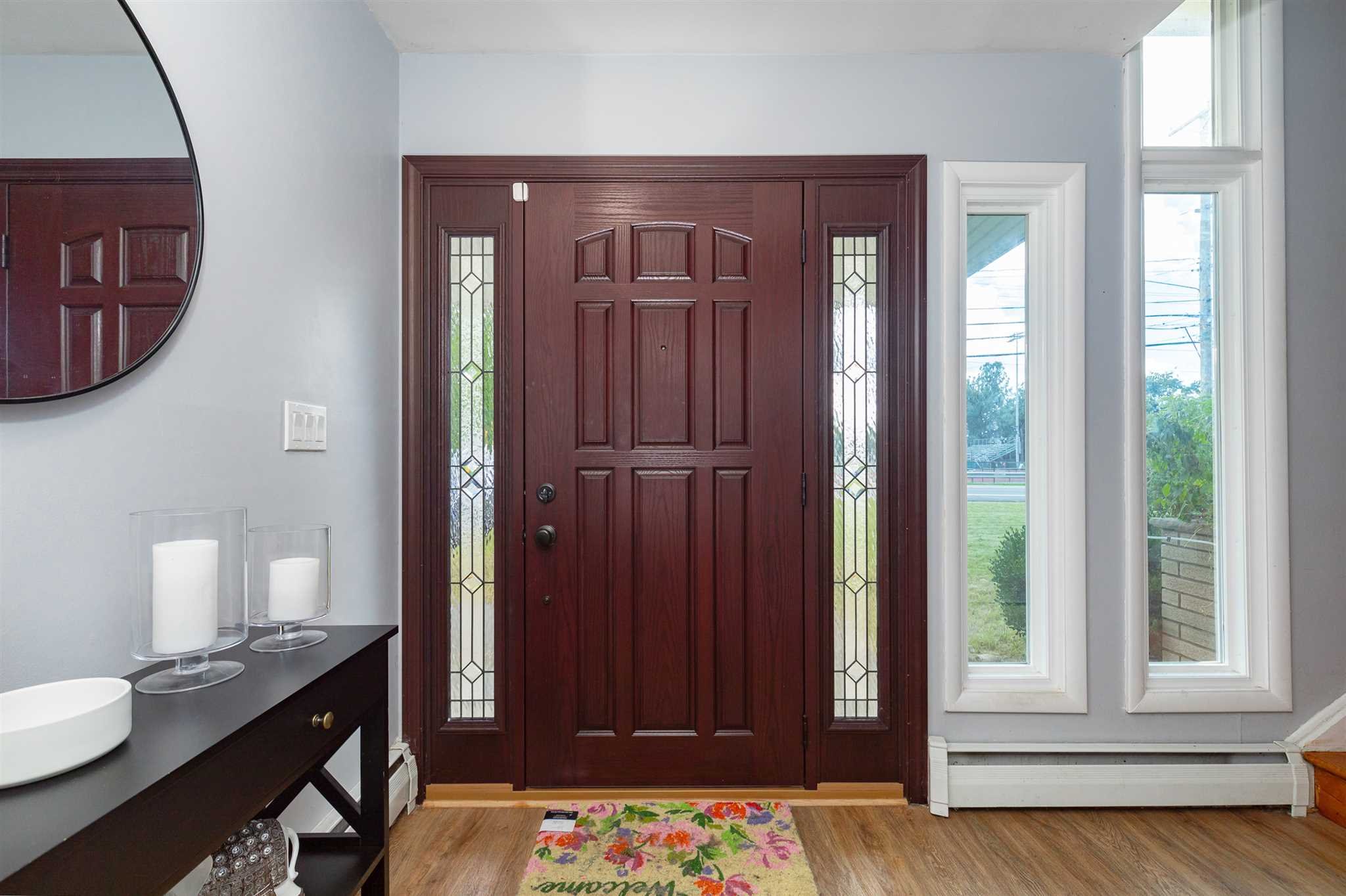 115 Spackenkill Road Poughkeepsie, NY 12603 - Photo 6 of 22 a view of a hallway with wooden floor and a cabinet