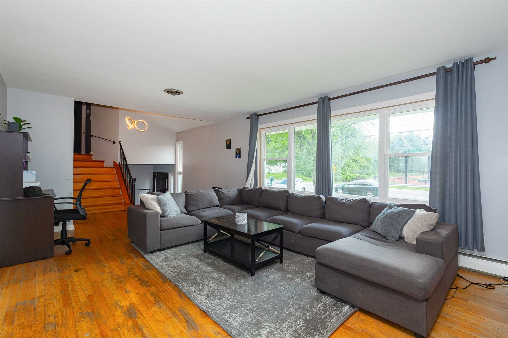 115 Spackenkill Road Poughkeepsie, NY 12603 - Photo 8 of 22 a living room with furniture and a large window