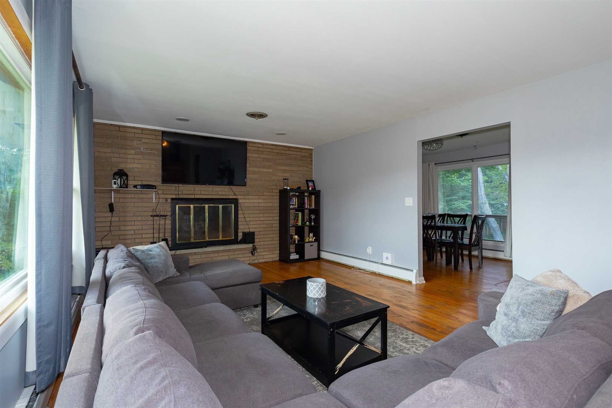 115 Spackenkill Road Poughkeepsie, NY 12603 - Photo 9 of 22 a living room with furniture and a flat screen tv