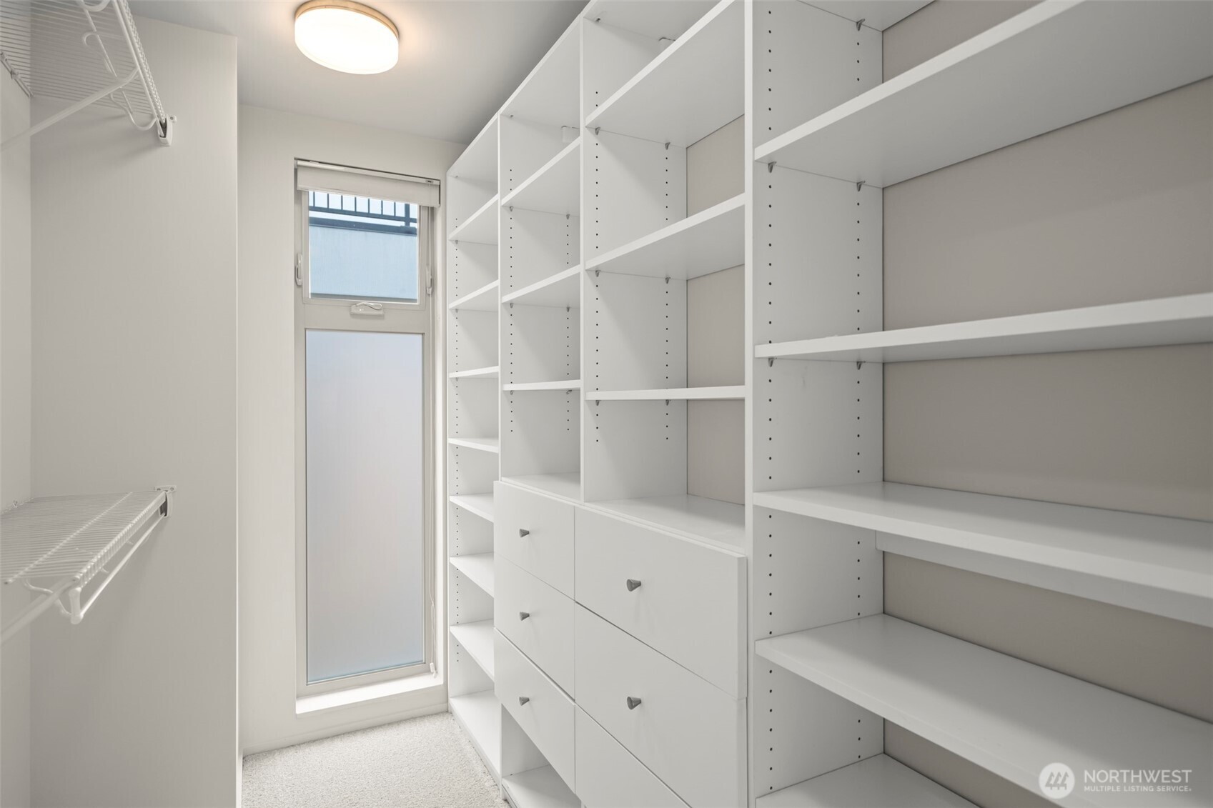 1810 23rd Avenue, Unit A Seattle, WA 98122 - Photo 11 of 26 a view of walk in closet with empty racks