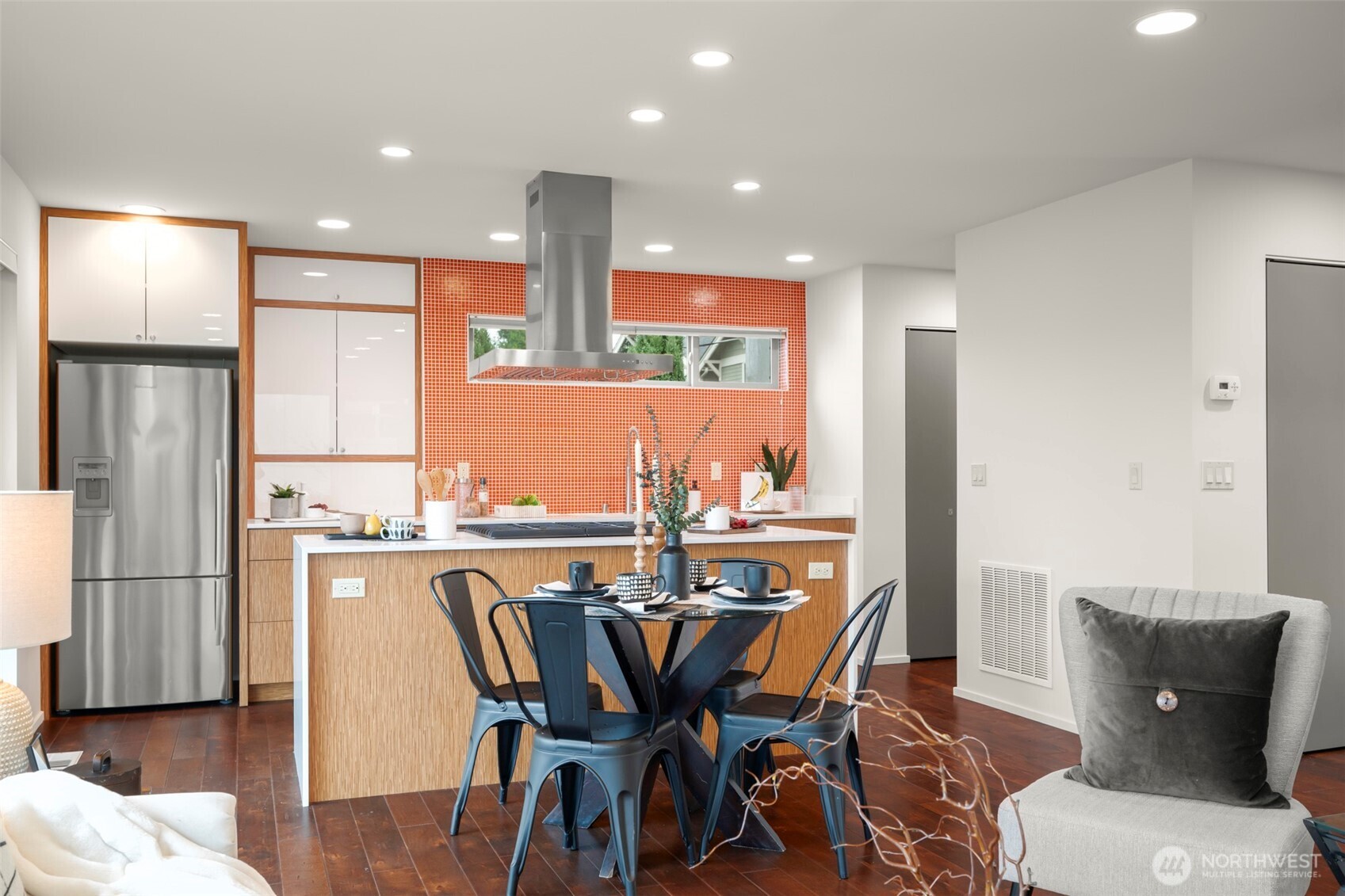 1810 23rd Avenue, Unit A Seattle, WA 98122 - Photo 13 of 26 a view of a dining room with furniture and wooden floor