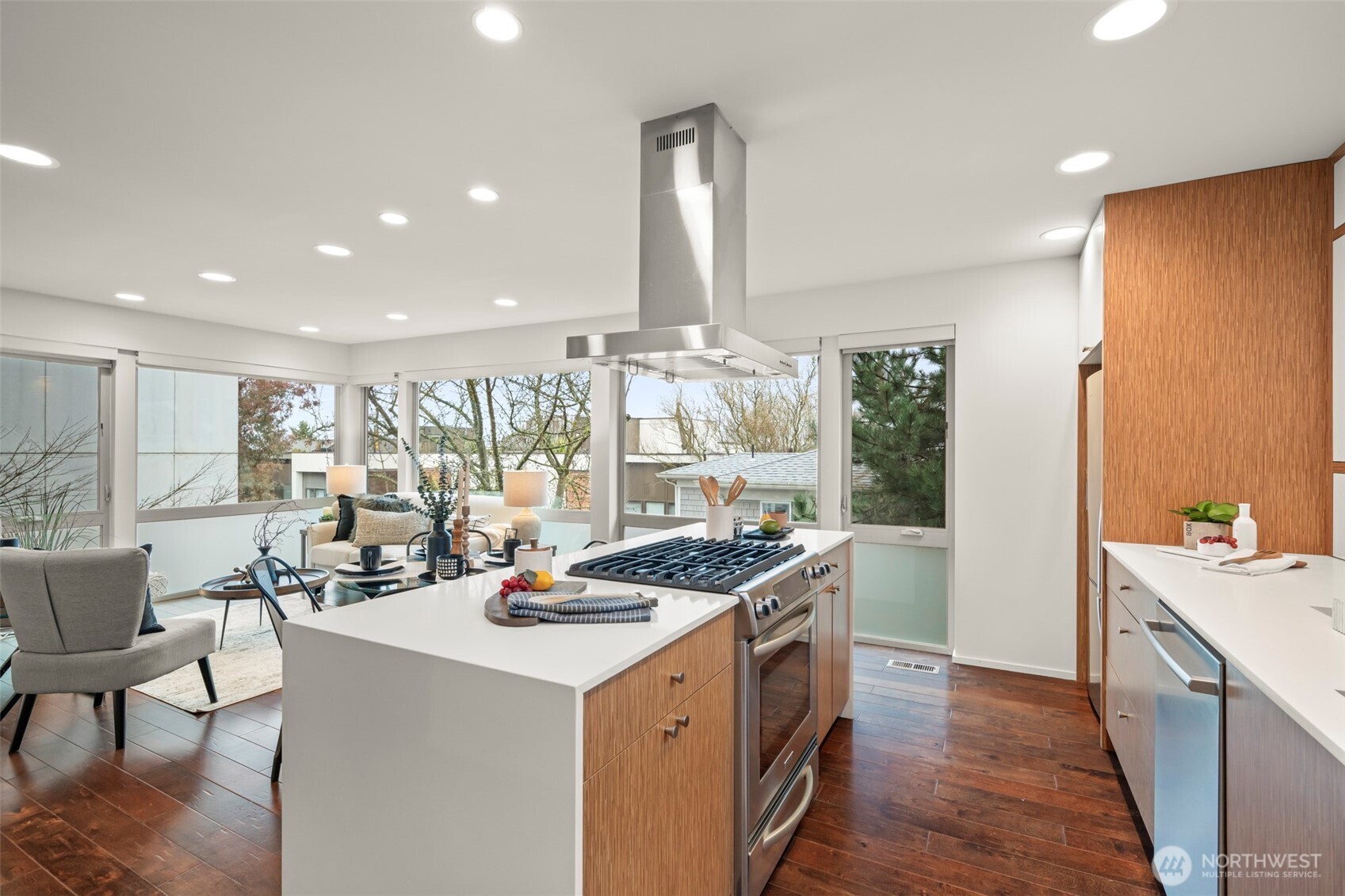 1810 23rd Avenue, Unit A Seattle, WA 98122 - Photo 14 of 26 a kitchen with stainless steel appliances kitchen island granite countertop a sink and cabinets