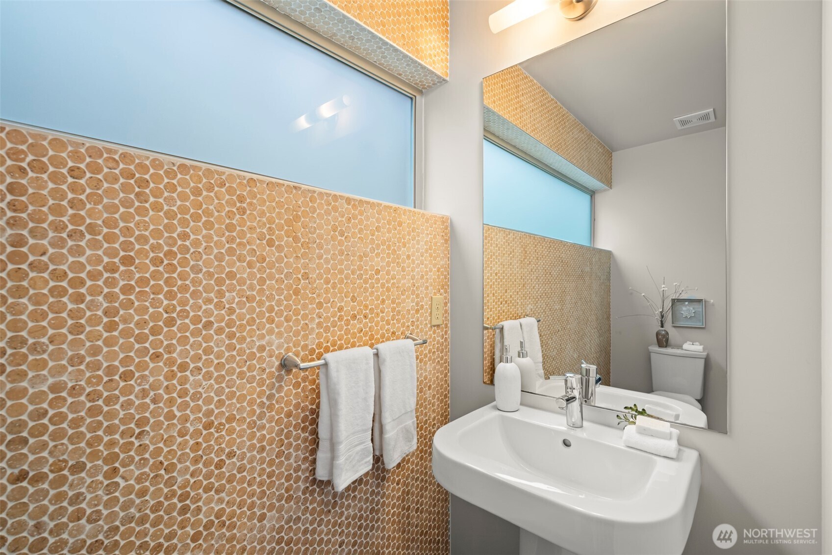 1810 23rd Avenue, Unit A Seattle, WA 98122 - Photo 18 of 26 a bathroom with a sink a mirror and shower curtain