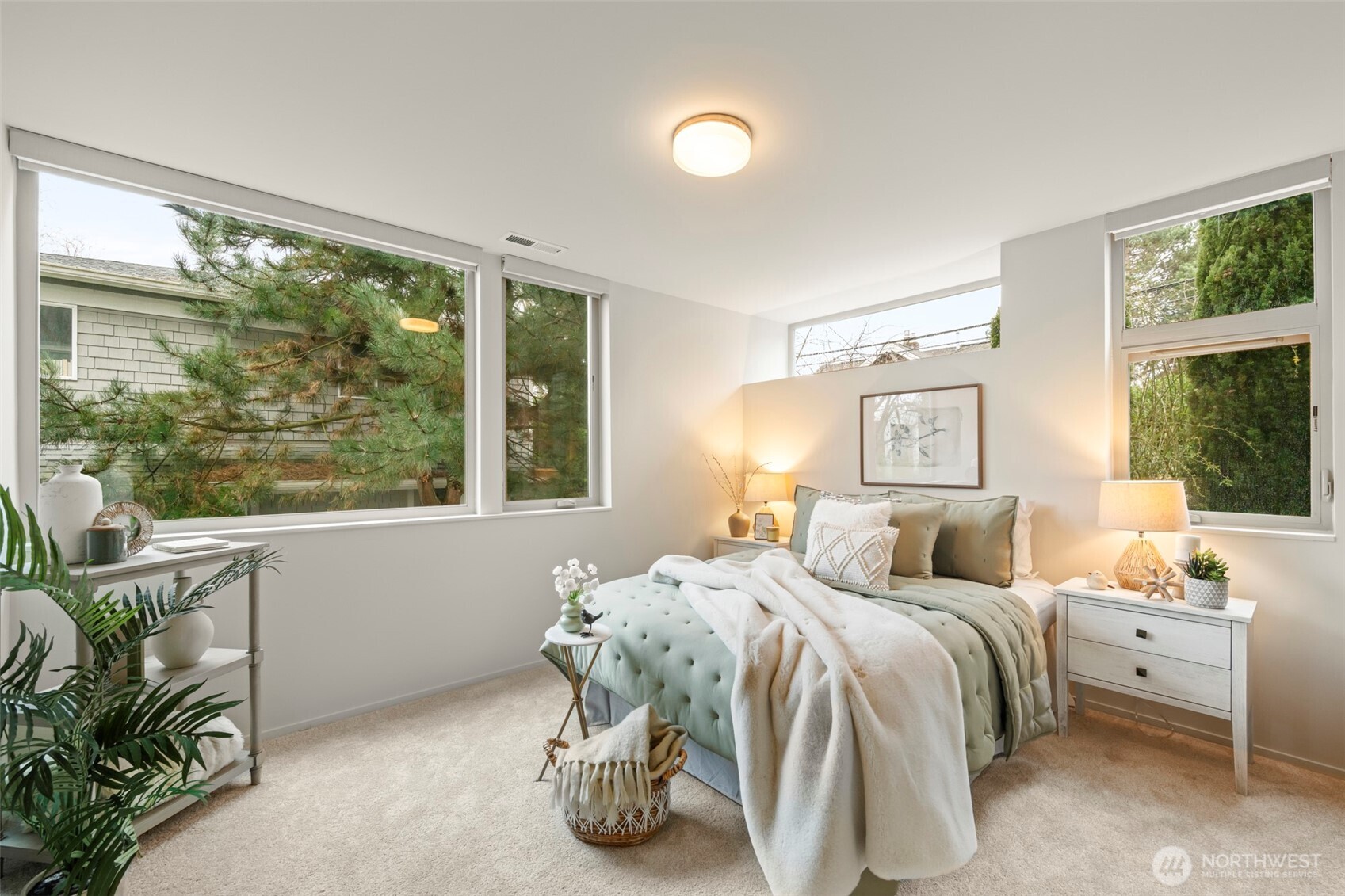 1810 23rd Avenue, Unit A Seattle, WA 98122 - Photo 19 of 26 a bedroom with a large bed and a large window