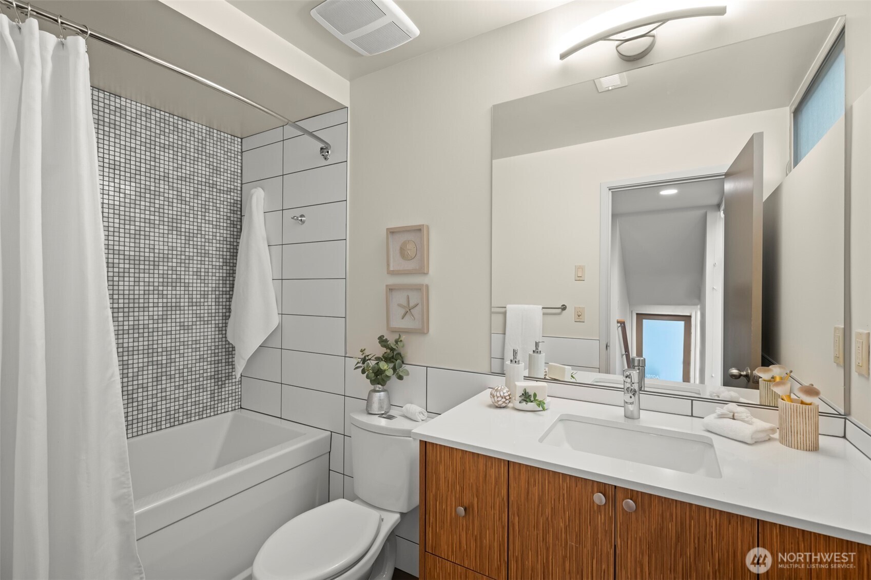 1810 23rd Avenue, Unit A Seattle, WA 98122 - Photo 21 of 26 a bathroom with a sink mirror toilet and bathtub