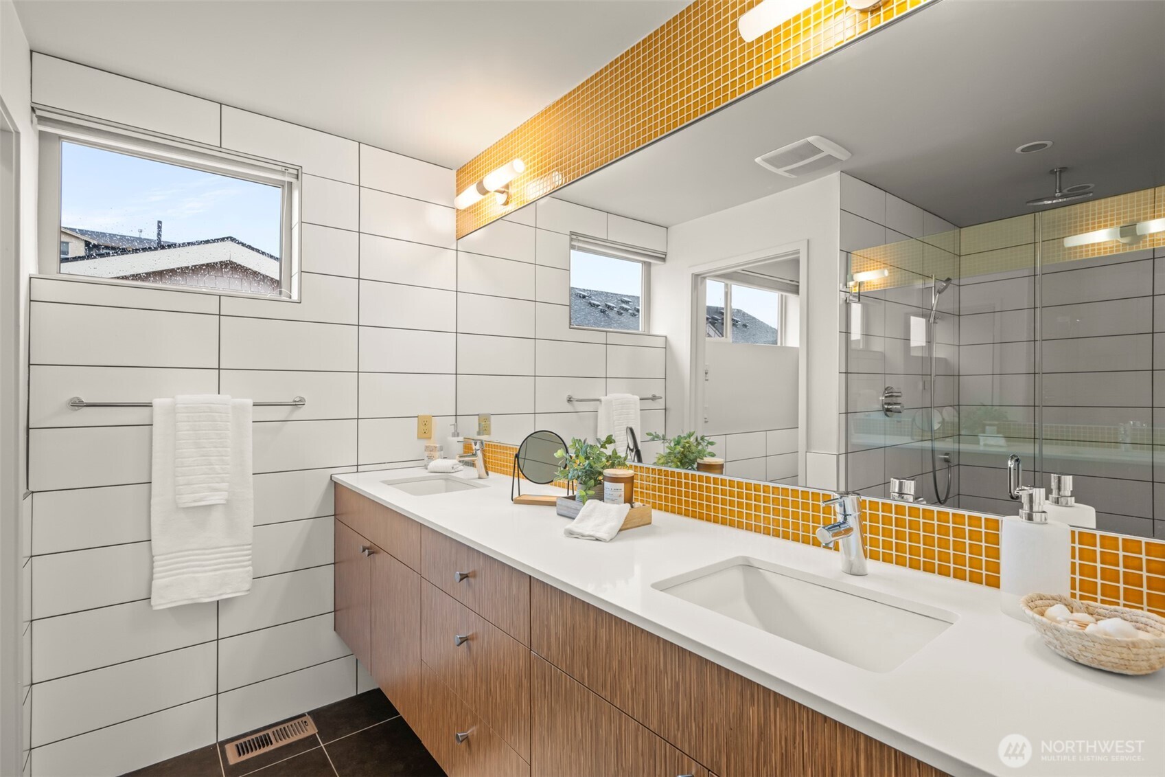 1810 23rd Avenue, Unit A Seattle, WA 98122 - Photo 9 of 26 a bathroom with a sink a large mirror and shower
