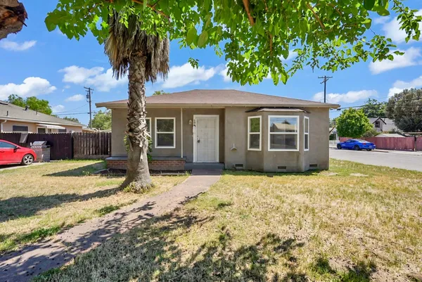 a house with trees in front of it