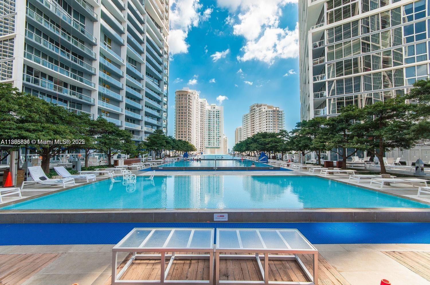 495 Brickell Avenue, Unit 3308 Miami, FL 33131 - Photo 13 of 15 a view of a swimming pool with outdoor seating
